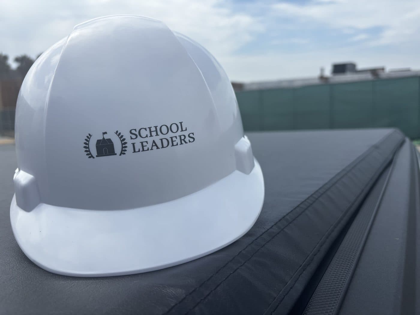 School Leaders branded hard hat on site