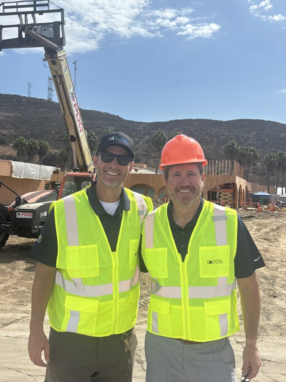 Two School Leaders advisors on site at a school construction project